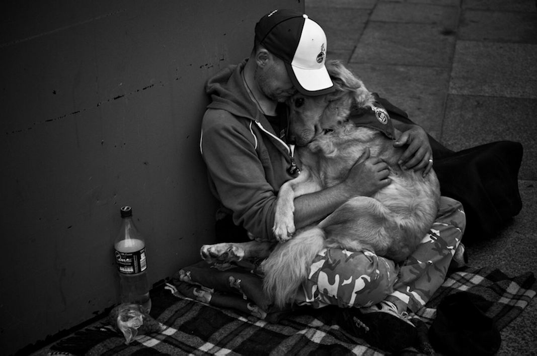 homeless-man-loving-and-holding-his-dog